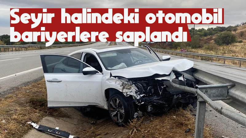 Seyir halindeki otomobil bariyerlere saplandı