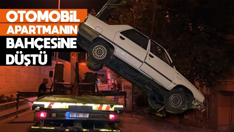 Otomobil apartmanın bahçesine düştü 